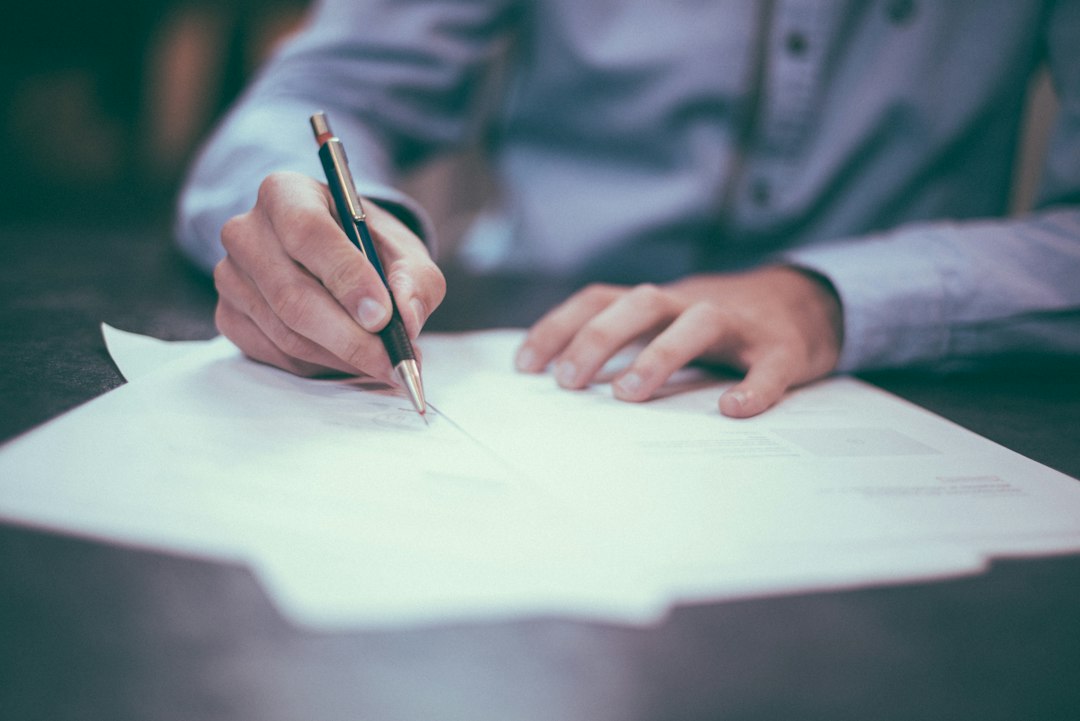 Buyer signing a notarial deed of deposit for an option payment in Spain