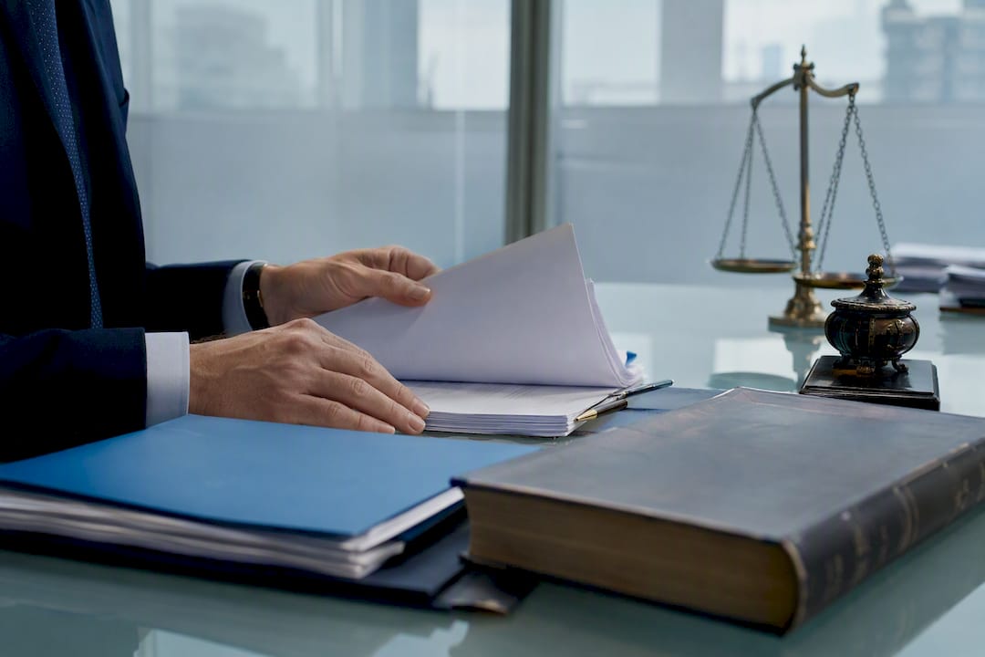 Lawyer manually inspecting property documents